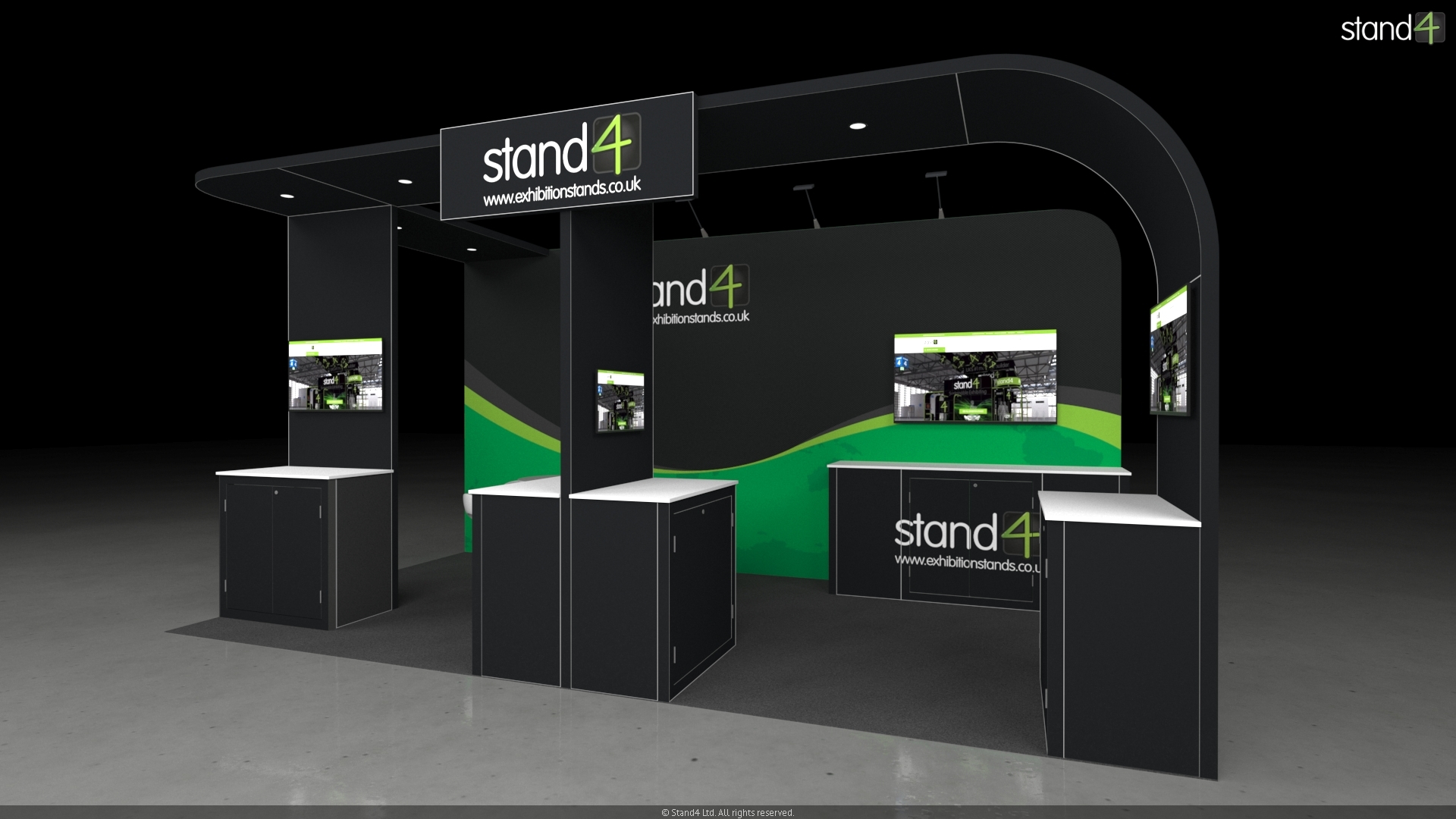 3D rendering of an open-plan exhibition stand featuring a large overhead canopy. The layout includes three front-facing presentation kiosks with digital screens and storage cabinets, a central meeting area with a high-top table and four bar stools, and a backwall equipped with overhead arm lights, a large monitor, and a long built-in counter.