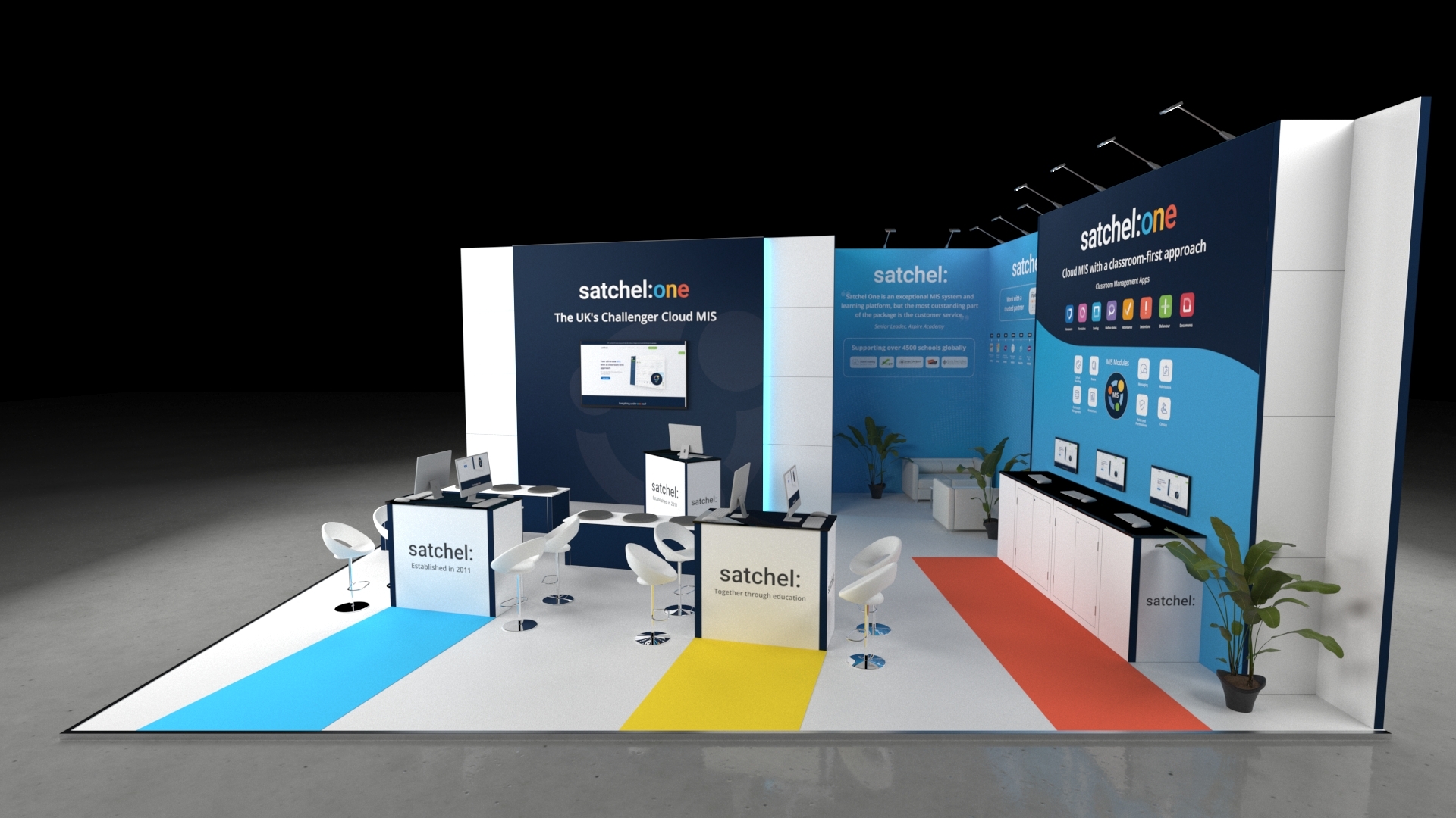 basildon3 Modern exhibition stand with multiple counters, seating areas, digital screens, and informational wall displays in a clean, open layout designed for product demonstrations and visitor engagement