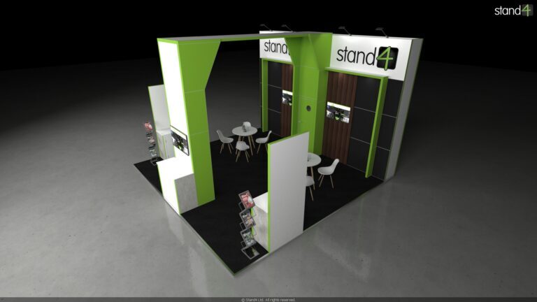 3D rendering of an exhibition stand featuring a tall central column connected to a backwall by an overhead bridge structure. The space includes two front display counters with zigzag literature racks, a central open area with two round meeting tables and chairs, and a backwall with integrated digital screens and a closed door leading to a storage room.