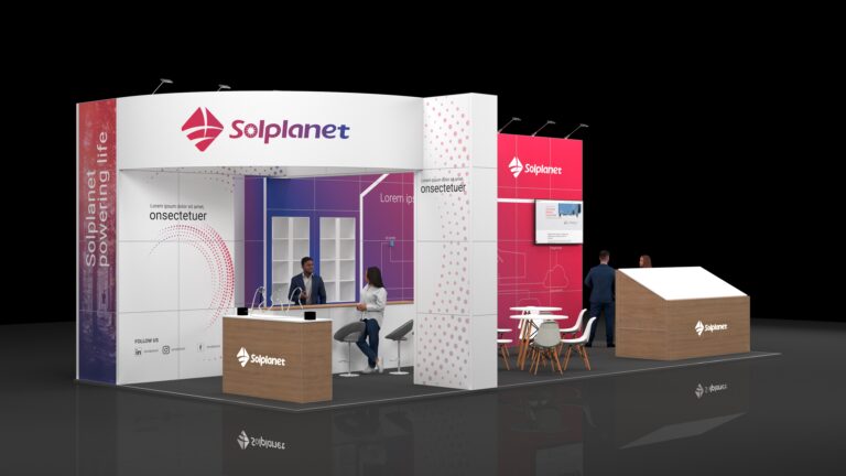 Modern exhibition stand featuring a front reception counter with stools, wall displays with digital screens, a small meeting area with a round table and chairs, and a sloped display structure, all arranged in an open, well-lit layout designed for visitor engagement.